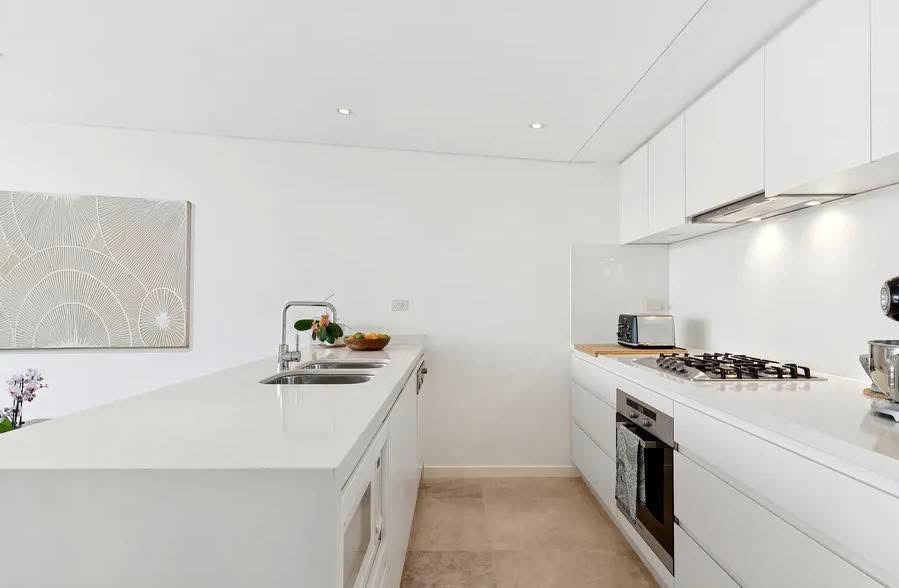 Bright white repainted kitchen with crisp ceiling