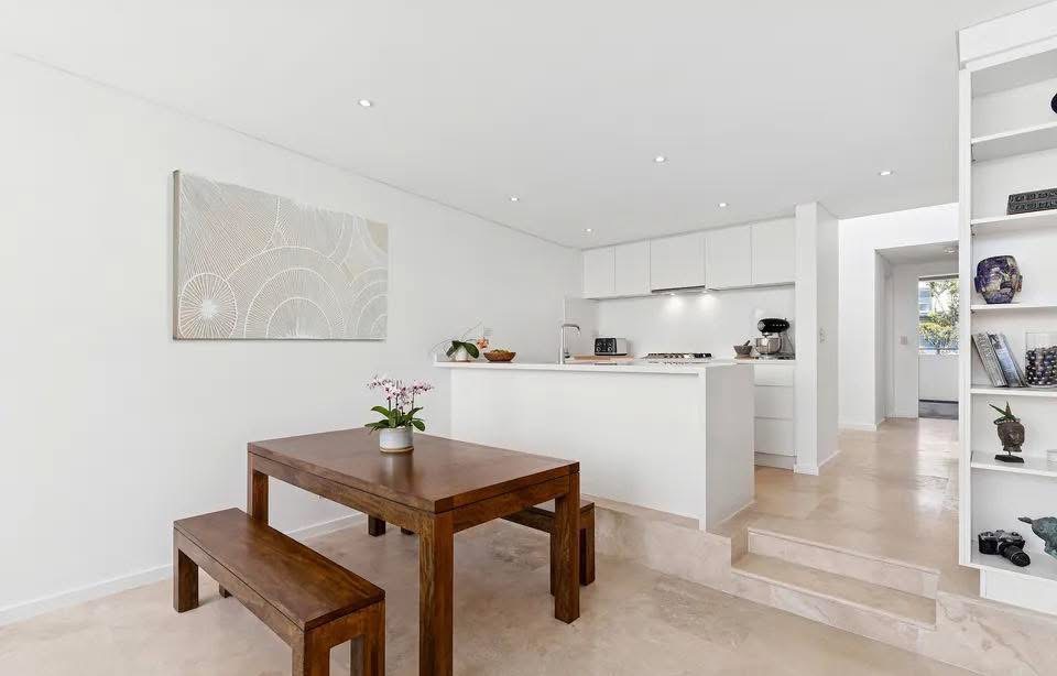 Repainted dining area and hallway in clean white